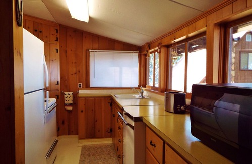 Deer Park Cabin | East Deer Lake waterfront cabin with sandy beach and large dock