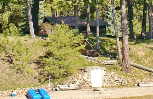 Deer Park Cabin | East Deer Lake waterfront cabin with sandy beach and large dock