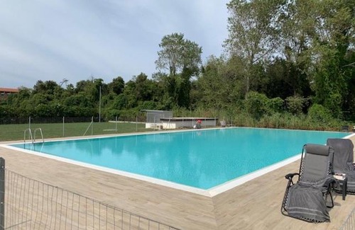 Calambrone Apartment | Elegant Seaside Apartment with Pool and Parking