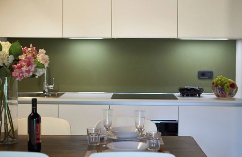 Riva del Garda Apartment | Elegant Top Floor Apartment "Salvia" with Mountain View & Balcony