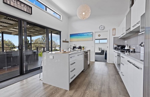 Newlands Arm House | Elevation: A stunning modern holiday home with a fantastic entertaining deck