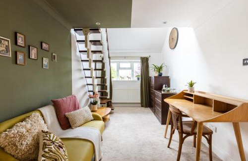 Hertford House | En-suite with double bed on mezzanine and desk in family home