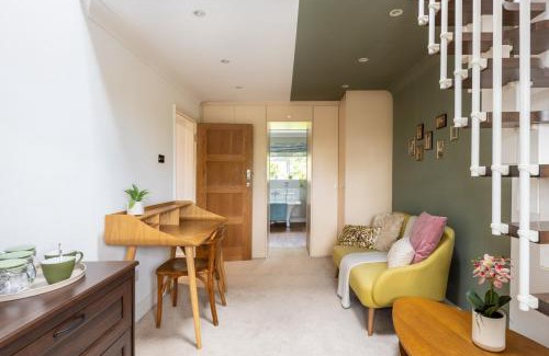 Hertford House | En-suite with double bed on mezzanine and desk in family home