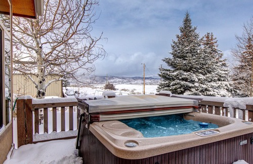 Highland Estates House | Enchanting dog-friendly home with hot tub, game room, fireplace, & washer/dryer
