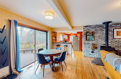 Sandpoint House | Enchanting dog-friendly alpine retreat with hot tub, deck, fire pit, W/D & views