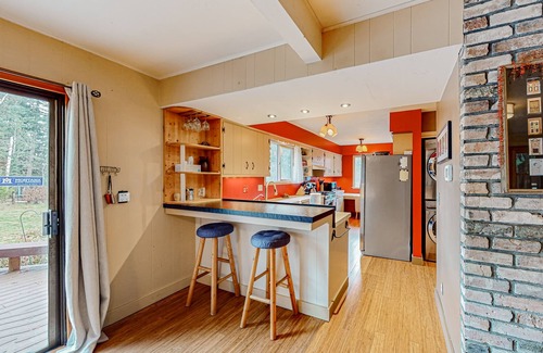 Sandpoint House | Enchanting dog-friendly alpine retreat with hot tub, deck, fire pit, W/D & views