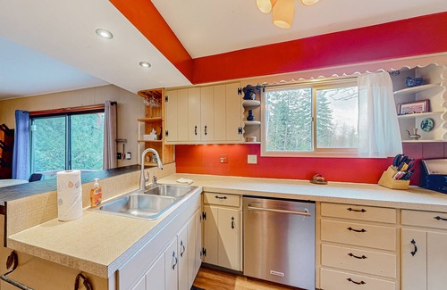 Sandpoint House | Enchanting dog-friendly alpine retreat with hot tub, deck, fire pit, W/D & views