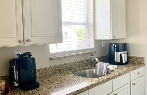 Anna Maria Condo | Endless Summer- On Pine Ave, steps to beach & pier w/water view & dock