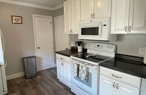 San Pedro Villas House | Enjoy a private pool, spacious lanai, and cozy Florida room with Murphy bed!