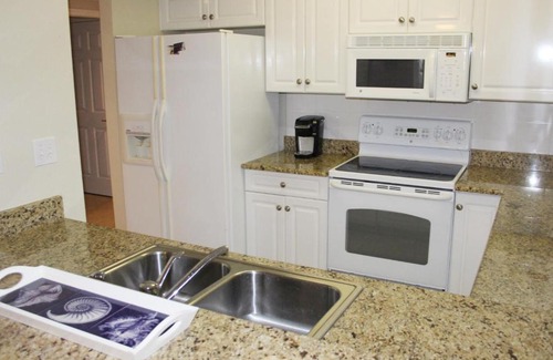 New Smyrna Beach Apartment | Enjoy breath taking sunsets in this 32 located right off the estuary OW10-403