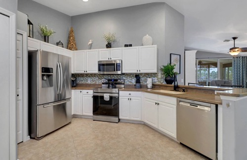 Fort Myers Condo | Enjoy the Colonial Country Club Lifestyle! Beautiful 2nd Floor Condo, Bikes & Tranquil Water Views!