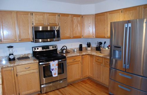 Northeast Colorado Springs House | Enjoy the large patio and shaded back yard of this large home with 2 kitchens