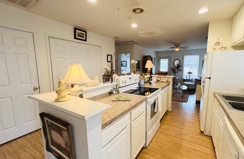 Colonial Beach House | Enjoy the screened side porch, covered front porch, the quick walk to the Beach