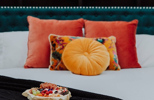 Fennville RV Rental | Enjoy the simplicity and elegance of a cozy bedroom in the woods.