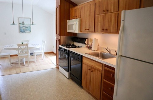 Brewster House | Enjoy this 1,600 sqft two story guest house with A/C, garage, balcony, and access to bike trail!