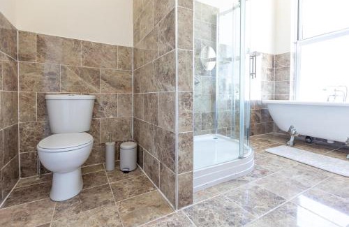 Rhyl House | Entire Home on Beach Front, Sleeps 25 with Free Parking