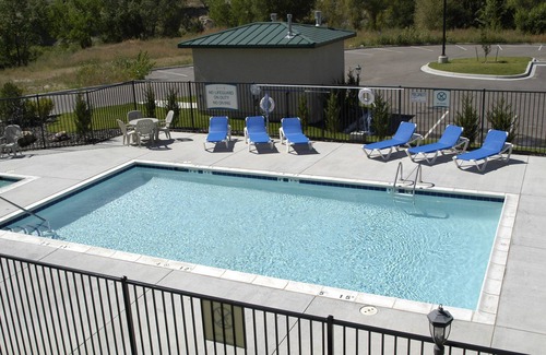 Northwest Colorado Springs Condo | Equipped Suite with FREE Breakfast, Outdoor Pool + Gym Access
