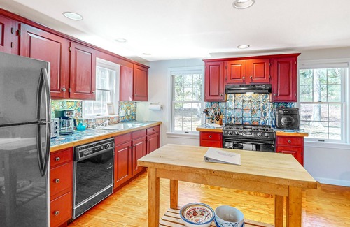 Falmouth House | Escape on conservation land with furnished deck, pond views, sunroom, & AC
