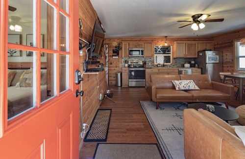 Long Barn Cabin | Escape to a cozy cabin in the pines where you can unwind, relax, and reconnect with nature.