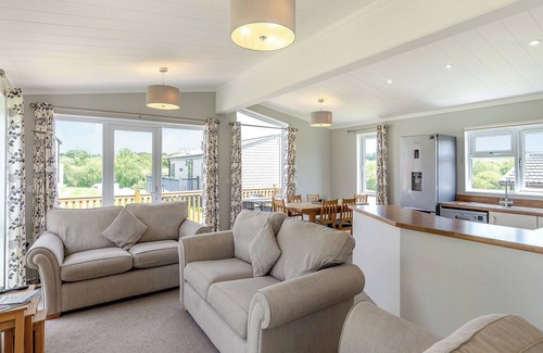 Hewas Water Ski Chalet | Escape to the Jasmine Lodge, nestled amidst stunning rolling countryside.