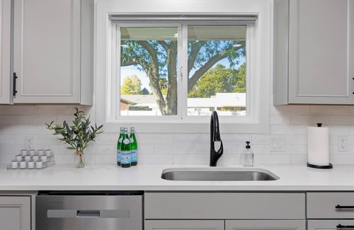 Burley House | Experience elevated comfort in this thoughtfully designed retreat. Featuring two inviting bedrooms, a fully equipped kitchen, and serene details, it blends simplicity with style for a clean, welcoming stay.
