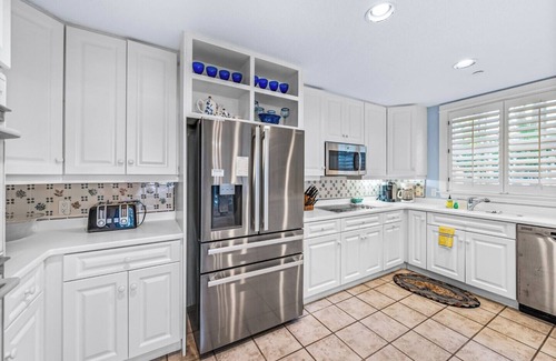 Boca Grande House | Experience luxury at B-505 Buttonwood, a spacious 4-bedroom, 3-bathroom home in Boca Bay