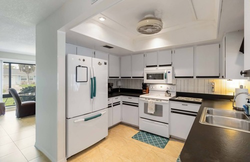 Port Charlotte House | Experience serenity in this fully furnished 3-bed, 3-bath waterfront home featuring a heated pool, spacious layout, and abundant natural light. Enjoy stunning water views from the master suite, living room and Florida room.