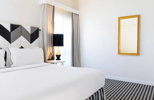 Norma Triangle Hotel | Explore An Exotic Three Unit Stylish Suite with Rooftop Pool! Pet-friendly!