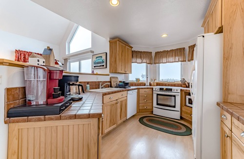 Gold Beach House | Exquisite home with spectacular views, deck, gas fireplace & game room