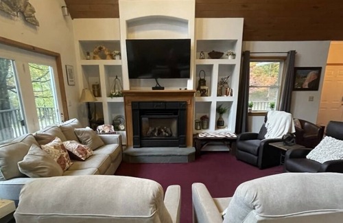 Shrewsbury Ski Chalet | Family Retreat! Large Game Room, fenced in yard with hot tub and fire pit.