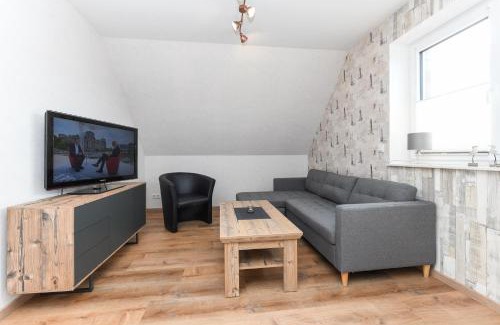 Neuharlingersiel Apartment | Ferienwohnung im Haus Hafenlicht