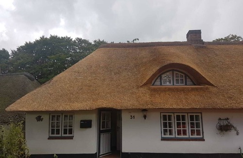 Leck Apartment | Fischerhuus Leck: Cozy vacation apartment for 2 people under thatch.