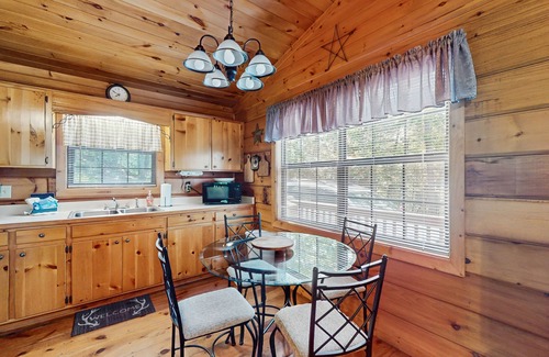 Cherry Log Cabin | Forest view cabin with private hot tub, furnished deck, fireplace, and grill