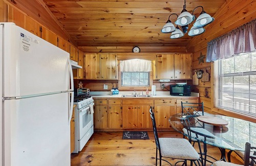 Cherry Log Cabin | Forest view cabin with private hot tub, furnished deck, fireplace, and grill