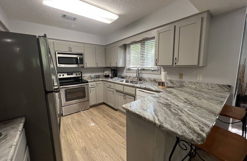 Mount Ida Condo | Forest view, log-sided two bedroom, two bath condo on Lake Ouachita. by RedAwning