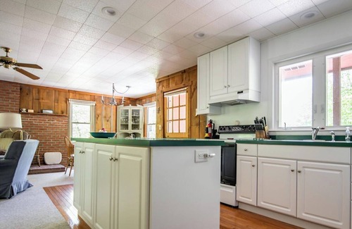 Laporte House | "Fountain Cottage" offers a large deck to enjoy your afternoon at Lake Mokoma