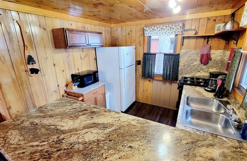 Arbor Vitae Cabin | Four Season Three Bedroom Cabin with private dock, firepit, kayaks/paddle boards