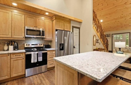 Charter Hills Cabin | French Flair Designed Custom Cabin with covered porch and gas firepit