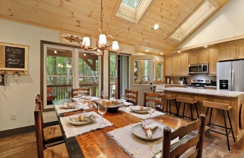 Charter Hills Cabin | French Flair Designed Custom Cabin with covered porch and gas firepit