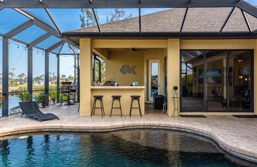Trafalgar House | Fresh Water Canal, Kayaks, Heated Pool - Villa Windows on the Water - Roelens Vacations