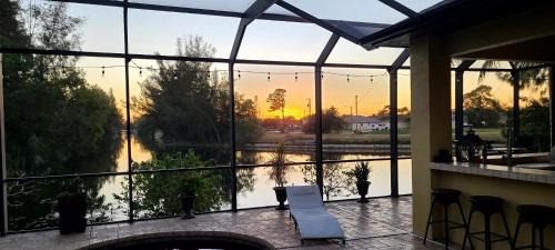 Trafalgar House | Fresh Water Canal, Kayaks, Heated Pool - Villa Windows on the Water - Roelens Vacations