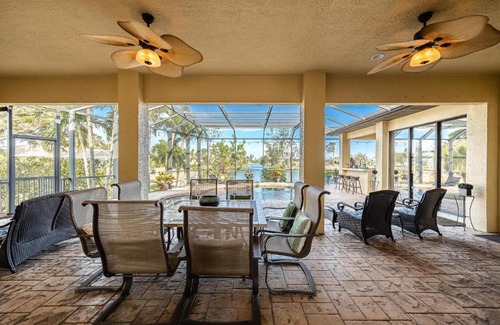 Trafalgar House | Fresh Water Canal, Kayaks, Heated Pool - Villa Windows on the Water - Roelens Vacations