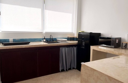 Barra de Colotepec Apartment | Fully equipped studio with AC and WiFi in Zicatela. Bed, kitchen and bathroom.