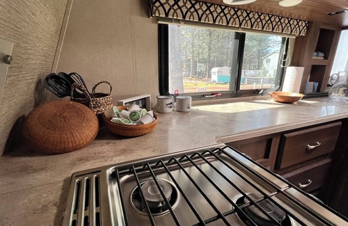 Weed House | Fully Equipped Travel Trailer in beautiful campground setting.