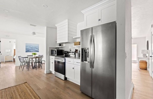 Palm River Estates House | Fully Updated Lake Front Home With Heated Pool!