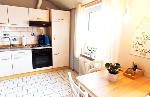 Dornumergrode Apartment | Gästehaus Zur alten Post Wohnung Ost