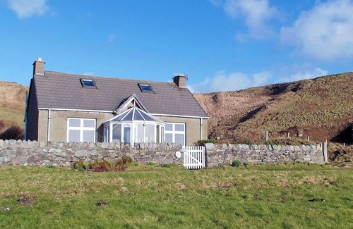 Bellochantuy Cottage | A detached cottage with views across to Gigha and the Paps of Jura.