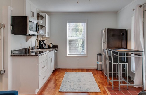 Salemtown Apartment | Germantown one bedroom suite with view of lush garden and hot tub