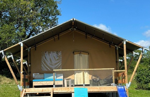 Jayac RV Rental | Glamping 'Safarilodge Prestige Tent 14 4 Pers' with Shared Pool, Private Terrace and Wi-Fi