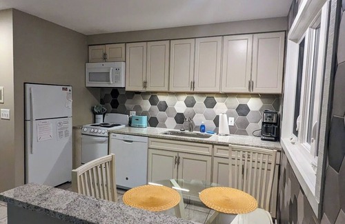 Maple City Condo | Glen Arbor condo in the woods w/screened porch, A/C, washer/dryer